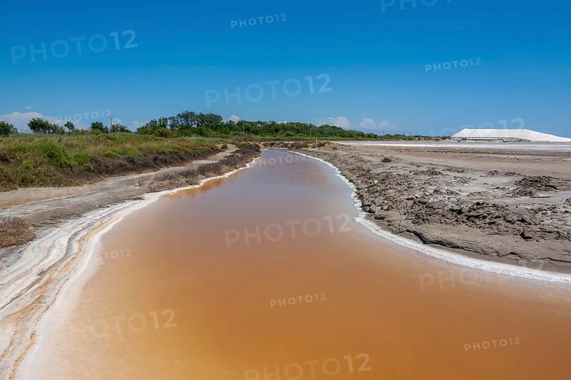 Scenery around Salin-de-Giraud located in in the Camargue area in southern France wich is showing lots of salt evaporation ponds in sunny ambiance
