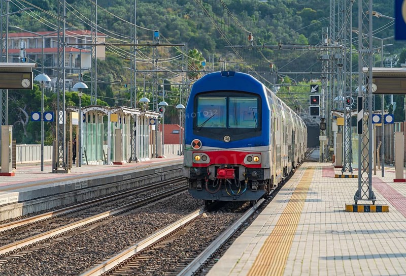 Railway station with train in Imperia, a city in Liguria, northern Italy