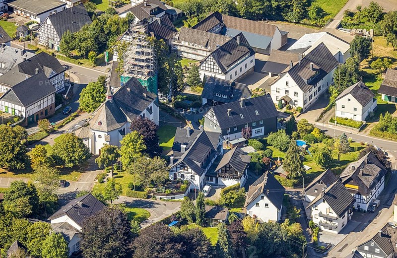 Aerial view, Heinsberg town centre and construction site and renovation work on the steeple of the Catholic parish church of St. Katharina, Heinsberg, Kirchhundem, Sauerland, North Rhine-Westphalia, Germany, construction work, construction area, construction site, scaffolding, building plots, construction project, construction site, DE, Europe, aerial view, aerial photography, aerial photography, new building, overview, bird's-eye view, overview