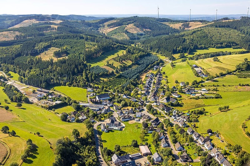 Aerial view, residential area local view district Heinsberg with Schützenhalle, forest area with forest damage and wind turbines in the hilly landscape, Heinsberg, Kirchhundem, Sauerland, North Rhine-Westphalia, Germany, tree death, DE, Europe, property tax, real estate, clear-cutting, calamity areas, aerial view, aerial photography, aerial photography, overview, bird's-eye view, forest, forest area, forest damage, forest dieback, forest area, residential area, housing and living, residential area, residential quality, residential neighbourhood, housing estate, residential area, birds-eyes view, overview