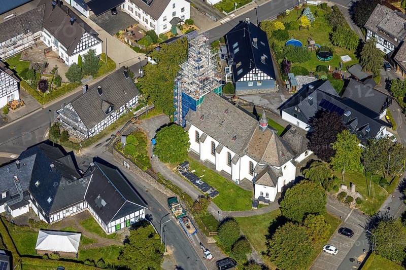 Aerial view, construction site and renovation work on the church tower of the Catholic parish church of St. Katharina, Heinsberg, Kirchhundem, Sauerland, North Rhine-Westphalia, Germany, construction work, construction area, construction site, scaffolding, building plots, construction project, construction site, DE, Europe, aerial view, aerial photography, aerial photography, new building, overview, bird's-eye view, bird's-eye view, overview