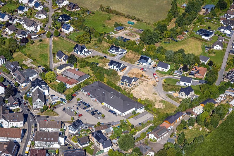 Aerial view, construction site with new construction residential area single-family houses Bockhelle, Penny supermarket, construction site Elspe, Lennestadt, Sauerland, North Rhine-Westphalia, Germany, construction work, construction area, building site, building plots, construction project, construction site, DE, single-family houses, Europe, property tax, real estate, Kirchhundem, aerial view, aerial photography, aerial photography, new building, overview, bird's-eye view, residential estate, living and living, residential area, residential buildings, residential quality, residential neighbourhood, residential estate, residential district, birds-eyes view, overview