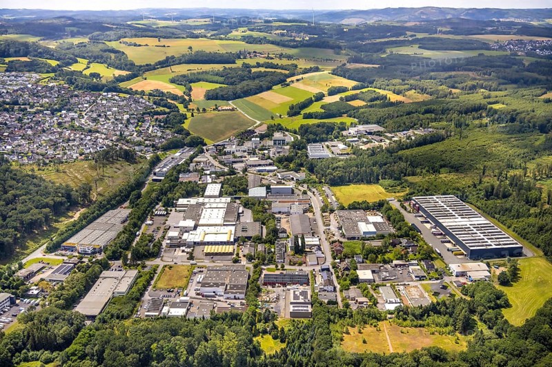 Aerial view, commercial area Wiebelsheide, behind residential area local view Herdringen, forest and meadows, distant view and blue sky with clouds, Herdringen, Arnsberg, Sauerland, North Rhine-Westphalia, Germany, commercial area, Wiebelsheide, residential area, local view, forest, meadows, distant view, blue sky, clouds, industrial area, residential buildings, nature, landscape, urban, rural, building, infrastructure, sky, daylight, village, trees, fields, real estate, region, development, perspective, bird's eye view