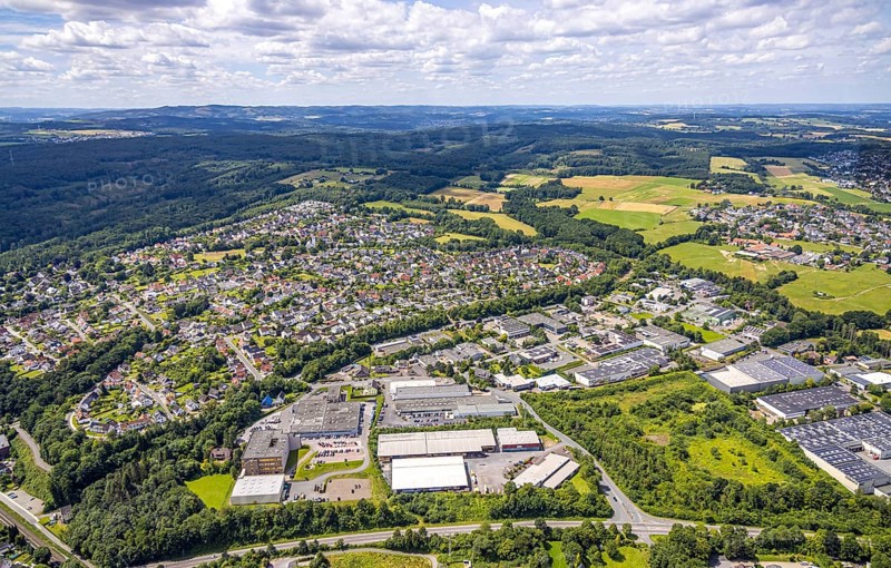 Aerial view, industrial area Von-Siemens-Straße, view of Bergheim, view into the Sauerland, distant view and blue sky with clouds, Bergheim, Arnsberg, Sauerland, North Rhine-Westphalia, Germany, DE, Europe, aerial view, aerial photography, aerial photography, Ruhr area, overview, bird's eye view, birds-eyes view, overview