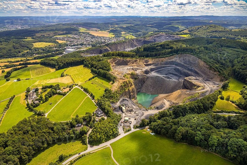 Aerial view, quarry Am Teussenberg, Ebel Steinbruchbetriebe Werk SBH, meadows and forest, distant view and blue sky with clouds, Herdringen, Arnsberg, Sauerland, North Rhine-Westphalia, Germany, quarry, Am Teussenberg, Ebel Steinbruchbetriebe, Werk SBH, meadows, forest, distant view, blue sky, clouds, nature, industry, landscape, trees, green areas, rocks, quarrying, day, aerial view, panorama, rural, environment, infrastructure, geology