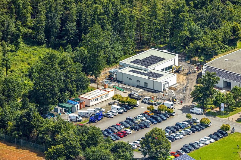 Aerial view, construction site at the Solepark next to the Solepark Große Wiese Freizeitbad Naß, Hüsten, Arnsberg, Sauerland, North Rhine-Westphalia, Germany, construction site, Solepark, leisure pool, Naß, Große Wiese, crane, machines, construction workers, structure, building, development, construction phase, infrastructure, leisure facility, swimming pool, urban, birds-eye view, landscape, urban planning, progress, industry, construction project, area, construction site vehicles, modern, Europe, area, summer, day, clear, sky