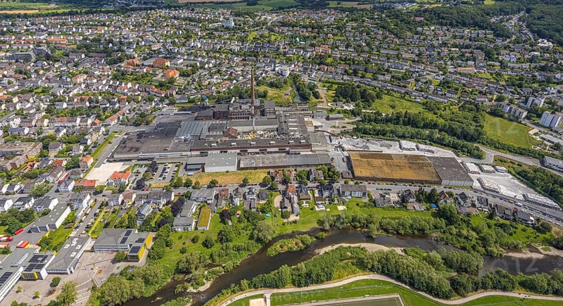 Aerial view, Reno de Medici plant for cardboard products on the river Ruhr, RDM Group, residential area, Arnsberg, Sauerland, North Rhine-Westphalia, Germany, Reno de Medici, plant, cardboard, products, river Ruhr, factory, industry, production, river, landscape, building, city, structure, commercial area, nature, green areas, roofs, infrastructure, aerial view, bird's eye view, European, summer, blue, sky, clouds