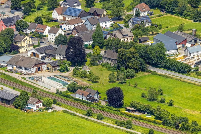Aerial view, St. Joseph Chapel, Church Im Rohrbruch, residential area and meadow area, Uentrop, Arnsberg, Sauerland, North Rhine-Westphalia, Germany, church, residential area, meadow area, architecture, religion, building, nature, city, landscape, green area, sky, trees, settlement, rural, village, houses, fields, summer, day, landmark, dome, tower, community, environment, tranquillity, idyll, village life, traditional, perspective, photography