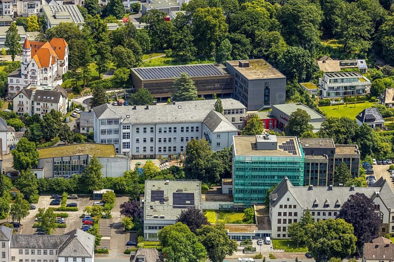 Aerial view, district house and district government, building renovation with cladding and scaffolding, behind the Gymnasium Laurentianum, Arnsberg, Sauerland, North Rhine-Westphalia, Germany, district house, district government, building, renovation, cladding, scaffolding, Gymnasium Laurentianum, renovation, architecture, construction site, authority building, school building, city view, aerial view, modernisation, construction work, institutions, education, administration, construction, urban, maintenance, reconstruction, infrastructure, security measures, scaffolding, office building, educational institution