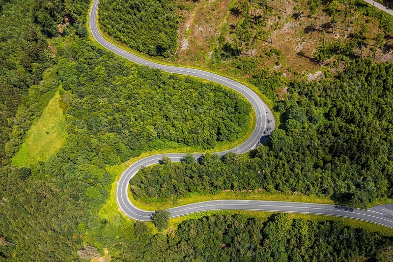 Aerial view, serpentines at the Ochsenkopf between Arnsberg and Sundern in the forest area with forest damage Stockumer Höhe, Sunderner Straße Landesstraße L685, Arnsberg, Sauerland, North Rhine-Westphalia, Germany, serpentines, Ochsenkopf, Sundern, forest area, forest damage, Stockumer Höhe, Sunderner Straße, National road L685, road, landscape, trees, nature, forest, aerial view, environmental damage, infrastructure, curves, traffic, Europe, scenic, height difference, outdoor, travel, surroundings, environment, regional, transport, nature shot, daylight, summer, recreation, green, mountains, elevation