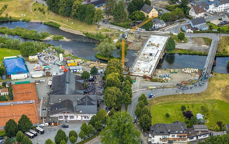 Aerial view, temporary bridge and construction site with new construction of the Dinscheder Ruhrbrücke Glösinger Straße (L735) over the river Ruhr and renaturalisation, Glösingen, Arnsberg, Sauerland, North Rhine-Westphalia, Germany, temporary bridge, construction site, new construction, Dinscheder Ruhrbrücke, Glösinger Straße, L735, river, Ruhr, renaturation, infrastructure, bridge, construction, construction work, river landscape, nature, environment, technology, traffic, road construction, development, engineering, spring, daylight, panorama, landscape, water, renovation, modernisation, aerial view, structure, bridge construction