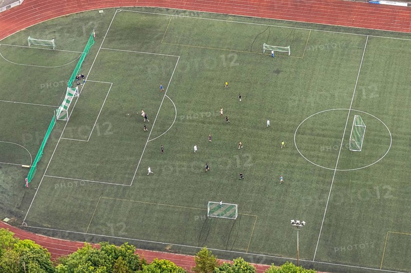 Aerial view, football stadium athletics stadium Auf dem Stöppel, sports field Bad Berleburg, youth players on the field, Bad Berleburg, Wittgensteiner Land, North Rhine-Westphalia, Germany, architecture, athletes, Auf dem Stöppel, outdoor shot, field, leisure, football stadium, green area, infrastructure, youth, youth players, children, landscape, athletics stadium, team, panorama, lawn, summer, pitch, sport, sports facility, sports field, day, training, stands, competition, rural