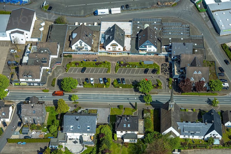 Aerial view, shopping place at the federal road B7, Zum Alten Güterbahnhof, car park, protestant cross church, Bestwig, Sauerland, North Rhine-Westphalia, Germany, shopping place, federal road B7, protestant cross church, church, buildings, cars, streets, infrastructure, village, town, region, landscape, traffic, retail, shops, shopping facilities, religion, architecture, sky, clouds, daytime, structured, orderly car parks, aerial view, environment, urban, rural