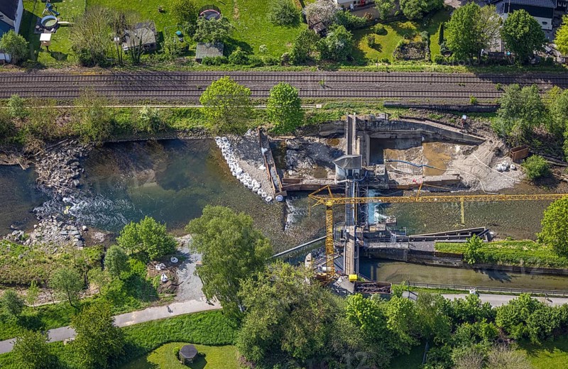Aerial view, construction site, construction work renovation weir Velmede, Velmede, Bestwig, Sauerland, North Rhine-Westphalia, Germany, construction site, construction work, renovation, weir, infrastructure, engineering, construction, renovation, hydraulic engineering, river, landscape, technology, drone image, project, development, workers, machines, equipment, excavator, concrete, riverbed, geography, region, environment, engineers, summer, daylight, transport, progress, architecture, bridge, location
