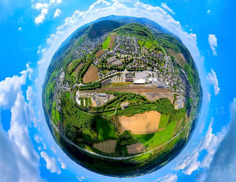 Aerial view, residential area local view and Bestwig Zum Alten Güterbahnhof and railway tracks, shopping centre with Rewe supermarket and Aldi supermarket, above the mountain monastery Bestwig, globe, fisheye image, fisheye image, 360 degree image, tiny world, little planet, fisheye image, Bestwig, Sauerland, North Rhine-Westphalia, Germany, Residential area, local view, railway tracks, shopping centre, Rewe supermarket, Aldi supermarket, mountain monastery, town, landscape, architecture, infrastructure, retail, buildings, monastery, supermarkets, structures, railway line, perspective, bird's eye view, rural, urban, village, panorama, panoramic view, geography, topography, aerial photography