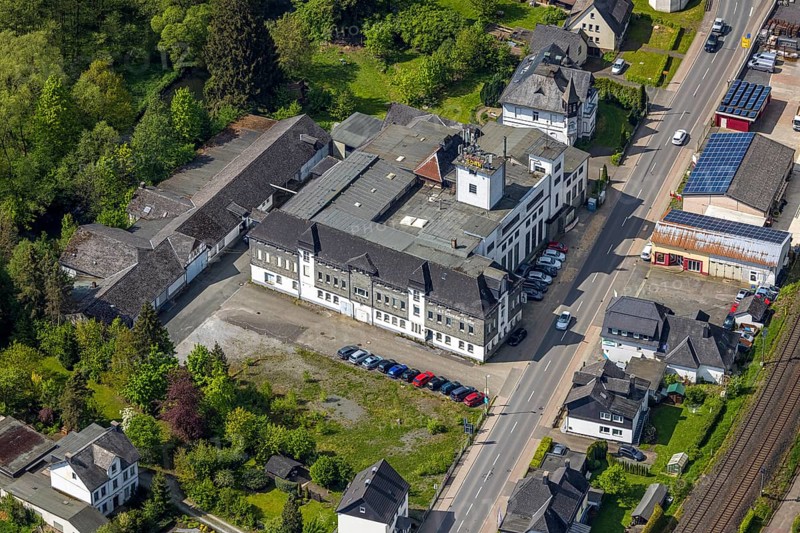 Aerial view, Schneider Korn distillery, H. & F. Schneider Holding GmbH & Co. KG Spirituosenhandel, Ostwig, Bestwig, Sauerland, North Rhine-Westphalia, Germany, Schneider Korn, Kornbrennerei, H. KG, Spirituosenhandel, building, architecture, company, industry, landscape, sky, clouds, business, factory, alcohol production, distillery, spirits, production, rural, infrastructure, nature, land, bird's eye view, services, traditional production