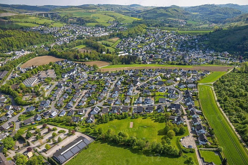 Aerial view, residential area local view Bestwig, Ostwig and Nuttlar with motorway A46 viaduct Nuttlar, in front car parks and vocational college Bergkloster with solar roof, Ostwig, Bestwig, Sauerland, North Rhine-Westphalia, Germany, residential area, local view, Nuttlar, motorway A46, viaduct Nuttlar, car parks, Berufskolleg, Bergkloster, solar roof, village, infrastructure, buildings, houses, streets, landscape, region, rural, settlement, architecture, traffic, renewable energy, solar plants, bridge, river, hill, green areas, nature, view, perspective, panorama