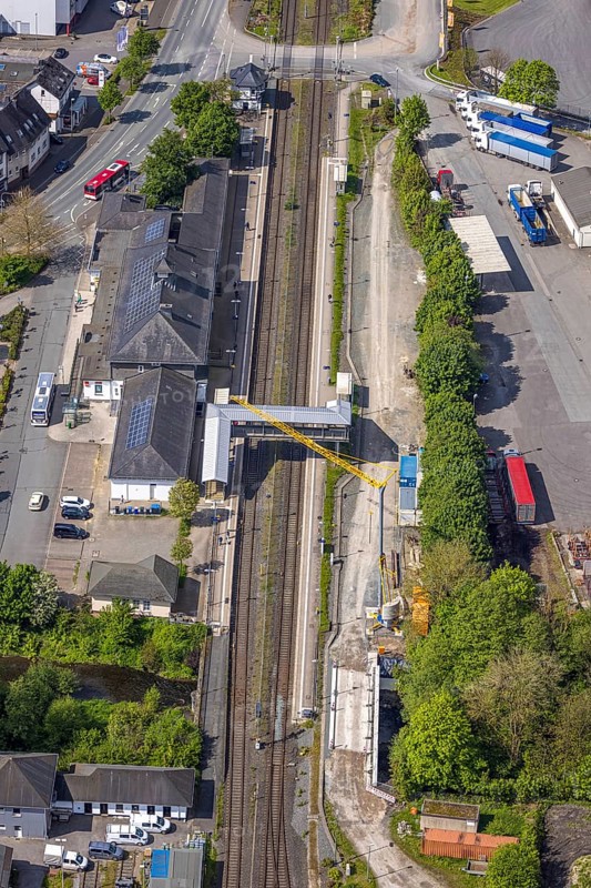 Aerial view, Bestwig railway station, Deutsche Bahn AG, construction site with construction crane, covered pedestrian crossing, Bestwig, Sauerland, North Rhine-Westphalia, Germany, railway station, construction site, construction crane, pedestrian crossing, covered, infrastructure, transport, railway, rail, construction work, architecture, city, building, traffic, development, construction process, bridge, summer, daylight, technology, urban, modern, industrial