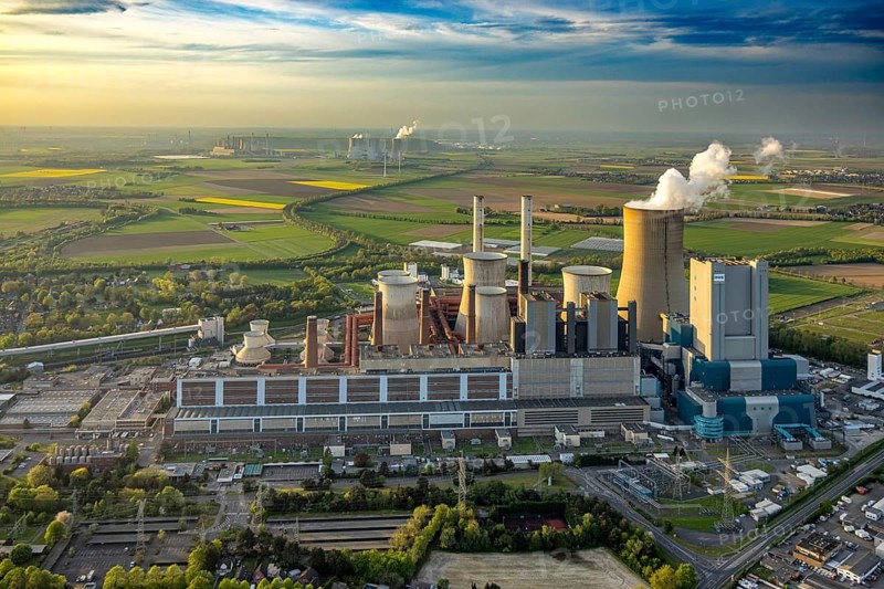 Aerial view, lignite-fired power plant Niederaussem, power plant site of RWE Power AG, cooling towers and smoke clouds, distant view, behind the RWE Power AG power plant Neurath, Bergheim, Rhineland, North Rhine-Westphalia, Germany, lignite-fired power plant, Niederaussem, power plant site, RWE Power AG, cooling towers, smoke clouds, Neurath, energy production, industry, environment, smoke, emissions, technology, infrastructure, landscape, sky, pollution, power generation, energy, coal-fired power plant, supply, electricity plant, power station, architecture, industrial landscape, building, energy supply, industrial, ecological footprint, air pollution, energy production, electricity, sustainability, CO2 emissions