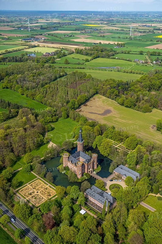 Aerial view, Museum Schloss Moyland, neo-Gothic moated castle and castle park surrounded by meadows and fields and forest, excursion destination on the Lower Rhine, Moyland, Bedburg-Hau, Lower Rhine, North Rhine-Westphalia, Germany, complex, architecture, excursion destination, exterior view, visit, trees, recreation, fields, leisure, building, history, green, sky, culture, landscape, museum, nature, park, tranquillity, Moyland Castle, castle park, beauty, sight, day, tourism, forest, water, meadows, European, historical, neo-Gothic moated castle