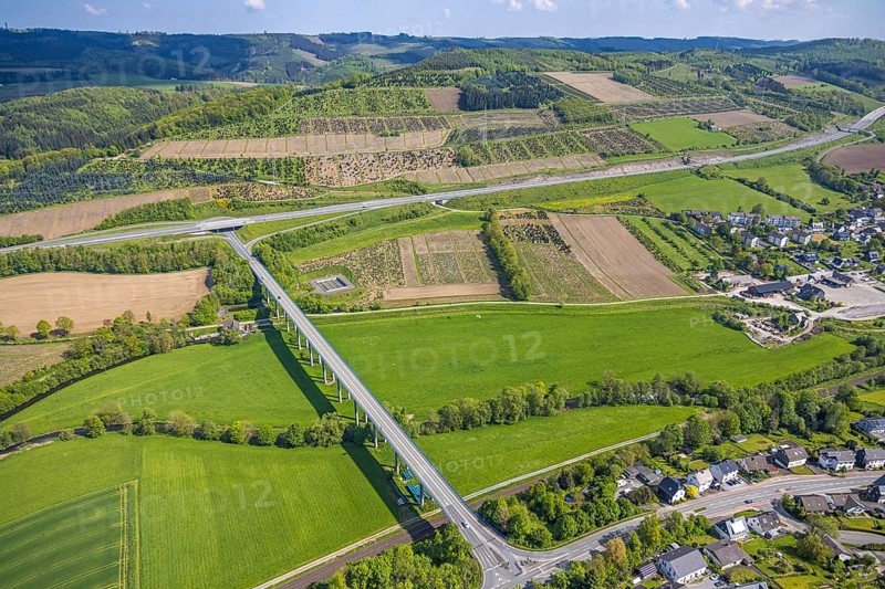 Aerial view, Ruhr valley bridge Velmede and motorway A46 junction Bestwig, tree plantations meadows and fields, Velmede, Bestwig, Sauerland, North Rhine-Westphalia, Germany, Ruhr valley bridge Velmede, motorway A46, junction Bestwig, tree plantations, meadows, fields, bridge, traffic, infrastructure, landscape, aerial view, nature, motorway, road, agriculture, rural, green area, panorama, areas, trees, regions, traffic junction, summer, daylight, architecture, bridge construction, areas, village, routing
