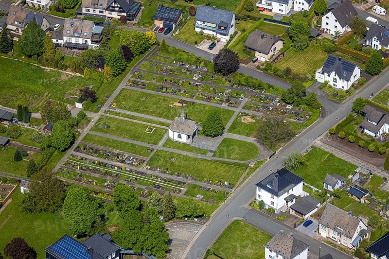 Aerial view, Nuttlar cemetery burial ground and cemetery chapel, Zum Kreuzberg, Nuttlar, Bestwig, Sauerland, North Rhine-Westphalia, Germany, cemetery, burial ground, cemetery chapel, landscape, cemetery grounds, architecture, chapel, building, gravestones, gravesites, peace, nature, green spaces, park, mountains, trees, peaceful, rural, view, sky, clouds, picturesque, religious, commemoration, historical site, contemplation, devotion, village, region, perspective, photography