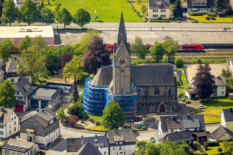 Aerial view, cat. Church of St. Anna, partial covering and scaffolding due to renovation work, Nuttlar, Bestwig, Sauerland, North Rhine-Westphalia, Germany, catholic church, St. Anna, partial covering, scaffolding, renovation work, church, architecture, renovation, restoration, building, religion, Christian, village, community, rural, aerial view, structure, tower, roofs, local view, monument, historical, construction project, church tower, summer, daylight, clear sky, Christian symbolism
