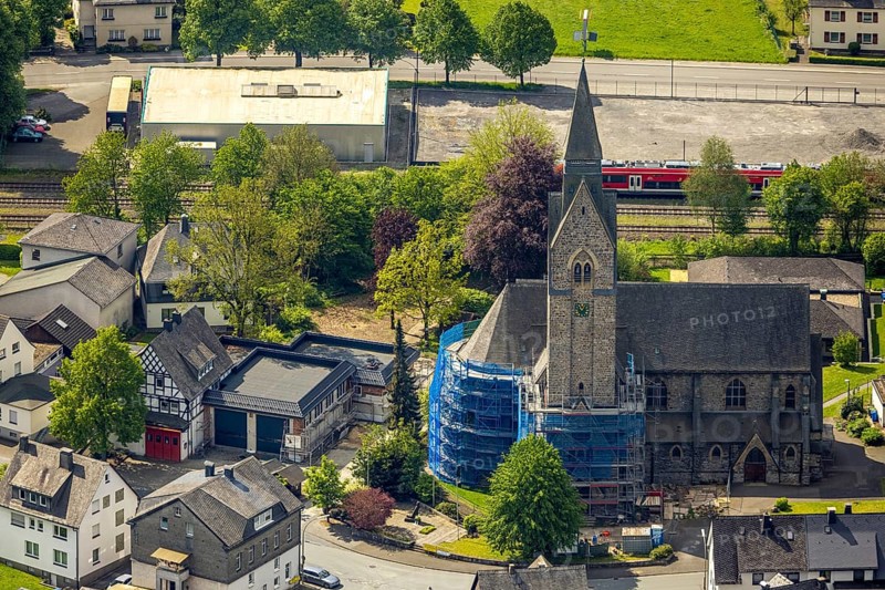 Aerial view, cat. Church of St. Anna, partial covering and scaffolding due to renovation work, Nuttlar, Bestwig, Sauerland, North Rhine-Westphalia, Germany, church, St. Anna, partial covering, scaffolding, renovation work, architecture, religious, historical, construction site, restoration, renovation, building, church tower, winter, afternoon, sunshine, village, surroundings, aerial view, perspective, religion, cultural heritage, rural, landscape