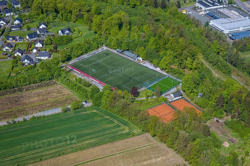 Aerial view, football stadium Ostwig sports ground, tennis courts, Ostwig, Bestwig, Sauerland, North Rhine-Westphalia, Germany, football stadium, sports ground, sports facilities, tennis, football, landscape, village, buildings, trees, green spaces, leisure, sport, athletics, infrastructure, recreation, open air, community, nature, architecture, city map, Europe, summer, daylight, playgrounds, competition, training, equipment