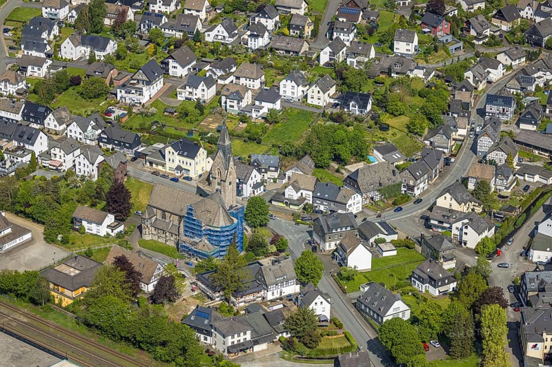 Aerial view, cat. Church of St. Anna, partial wrapping and scaffolding due to renovation work, Oertsansicht residential area, Nuttlar, Bestwig, Sauerland, North Rhine-Westphalia, Germany, church, St. Anna, partial wrapping, scaffolding, renovation work, residential area, architecture, building, renovation, village, religion, Christian, sacral, place, town, construction work, renovation, aerial view, building wrapping, autumn, abundance, bird's eye view, technology, restoration, rural, European, infrastructure