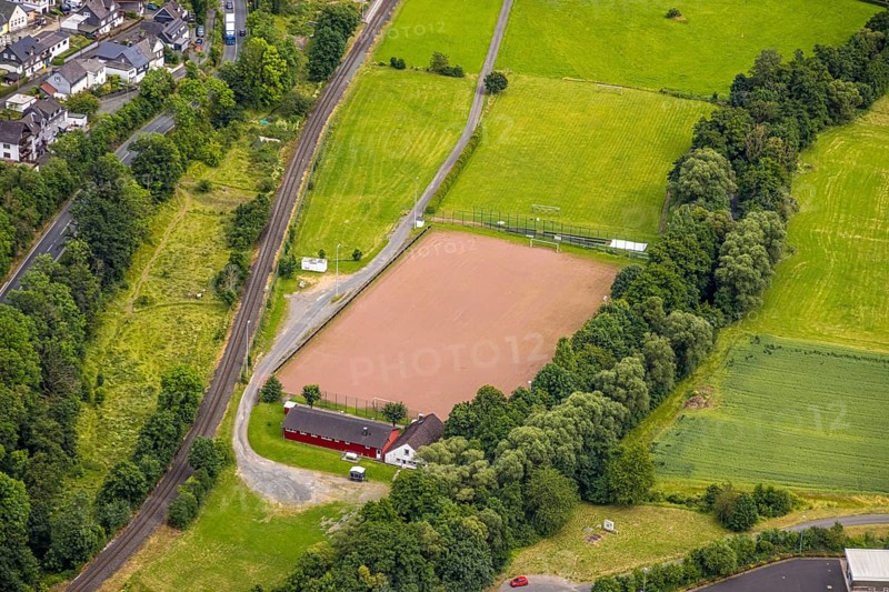 Aerial view, Niederlaasphe sports field, Niederlaasphe SG, Niederlaasphe, Bad Laasphe, Wittgensteiner Land, North Rhine-Westphalia, Germany, trees, village, drone shot, recreation, outdoor sports, leisure, spring, football pitch, building, municipality, green, green area, hill, infrastructure, landscape, nature, region, summer, playing field, sports facilities, sports facilities, sports field, sports event, town, daylight, stands, surroundings
