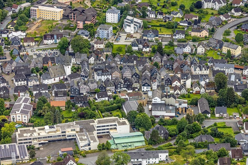 Aerial view, Municipal grammar school, old town with historic houses and protestant town church, residential area between Gartenstraße and Steinackerstraße, catholic church St. Peter and Anna, above area of the former Emmaburg-Klinik, Bad Laasphe, Wittgensteiner Land, North Rhine-Westphalia, Germany, old town, architecture, protestant town church, Gartenstraße, building, area, church towers, landscape, religion, summer, town view, Steinackerstraße, streets, urban, daytime, daytime, former Emmaburg-Klinik, Bad Laasphe, Germany. Town church, Gartenstraße, Building, Grounds, Church towers, Landscape, Aerial view, Religion, Summer, Town view, Steinackerstraße, Streets, Urban, Daytime, Residential area, Former Emmaburg Clinic, Historic houses