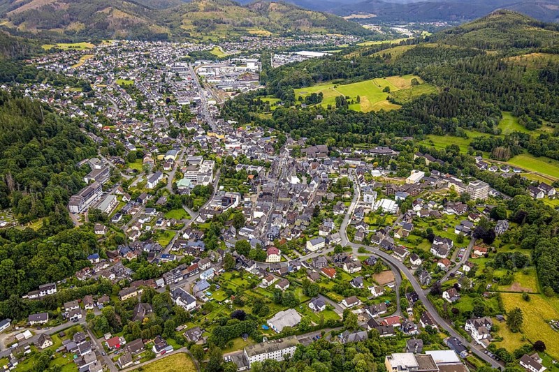 Aerial view, residential area local view, surrounded by hilly forest landscape with forest damage, Bad Laasphe, Wittgensteiner Land, North Rhine-Westphalia, Germany, trees, village, roofs, recreation, forest, community, green, timber industry, houses, hill, contrast, landscape, nature, local view, perspective, region, damage, settlement, summer, urban planning, streets, daylight, topography, environment, environmental, environmental problems, urban, forest, forest landscape, forest damage, residential area, hilly, rural, vegetation