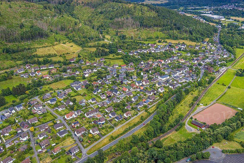 Aerial view, sports field Niederlaasphe, Niederlaasphe SG, residential area local view at the forest Niederlaasphe, Bad Laasphe, Wittgensteiner Land, North Rhine-Westphalia, Germany, architecture, trees, recreation, open air, leisure, building, community, green, houses, small town, landscape, landscape view, aerial view, nature, Niederlaasphe, local view, region, sector, settlement, playing field, sports field, townscape, structure, daylight, environment, forest, residential area, village, rural, review
