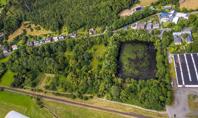 Aerial view, forest area with pond Amalienhütter Weiher, residential area, Niederlaasphe, Bad Laasphe, Wittgensteiner Land, North Rhine-Westphalia, Germany, Amalienhütter Weiher, architecture, outdoor shot, trees, village, recreation, Europe, green area, houses, idyll, landscape, recreation area, nature, peace, summer, silence, scenery, pond, environment, bird's eye view, forest area, water, German forest, rural