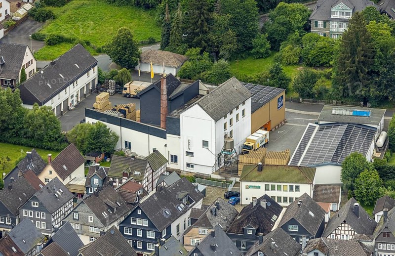 Aerial view, Bosch Brewery on the River Laasphe, Bad Laasphe, Wittgensteiner Land, North Rhine-Westphalia, Germany, architecture, Bosch Brewery, brewery, brewing art, bridge, Europe, factory, river, river Laasphe, building, trade, hill, industry, infrastructure, culture, landscape, nature, panorama, production, region, city, city view, road, tradition, transport, environment, bird's eye view, forest, water, wooded, rural, economic