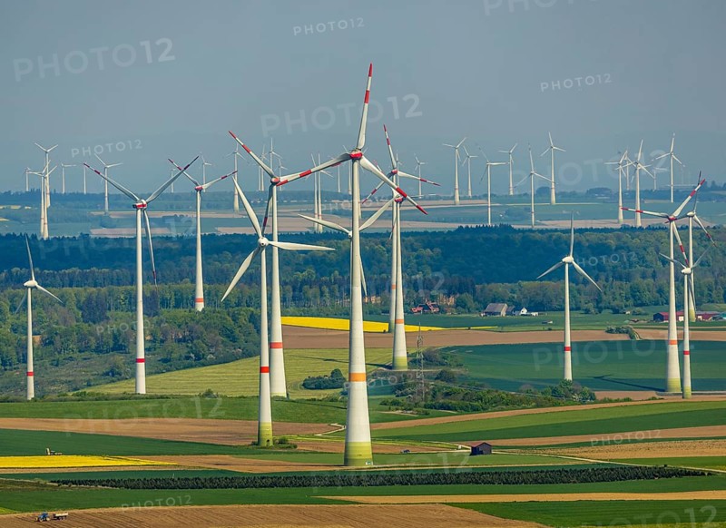 Aerial view, wind park and wind farm wind energy plant, wind turbines and rape fields near Radlinghausen, Messinghausen, Brilon, East Westphalia, Sauerland, North Rhine-Westphalia, Germany, wind park, wind farm, wind energy plant, wind turbines, rape fields, Radlinghausen, renewable energy, landscape, green, nature, agriculture, energy production, sustainability, environment, fields, rural, village, rural, infrastructure, engineering, technology, ecology, summer, sky, clean, power generation, perspective, aerial view