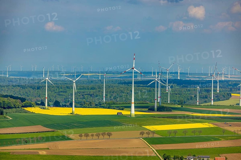 Aerial view, wind park and wind farm wind energy plant, wind turbines and rape fields near Radlinghausen, Messinghausen, Brilon, East Westphalia, Sauerland, North Rhine-Westphalia, Germany, wind park, wind farm, wind energy plant, wind turbines, rape fields, Radlinghausen, renewable energy, sustainability, agriculture, landscape, spring, green, yellow, nature, environment, energy production, fields, production, aerial view, rural, technology, weather, clear sky, infrastructure, ecological, turbines, power generation, clean energy