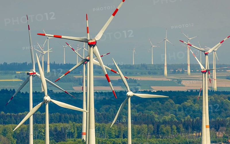 Aerial view, wind park and wind farm wind energy plant, wind turbines and rape fields near Radlinghausen, Messinghausen, Brilon, East Westphalia, Sauerland, North Rhine-Westphalia, Germany, wind park, wind farm, wind energy plant, wind turbines, rape fields, Radlinghausen, renewable energy, landscape, agriculture, environmentally friendly, green, sustainable energy, energy production, fields, infrastructure, technology, nature, photovoltaics, clouds, sky, aerial view, agricultural landscape, rural, spring, yellow, perspective from above, panorama, clean energy