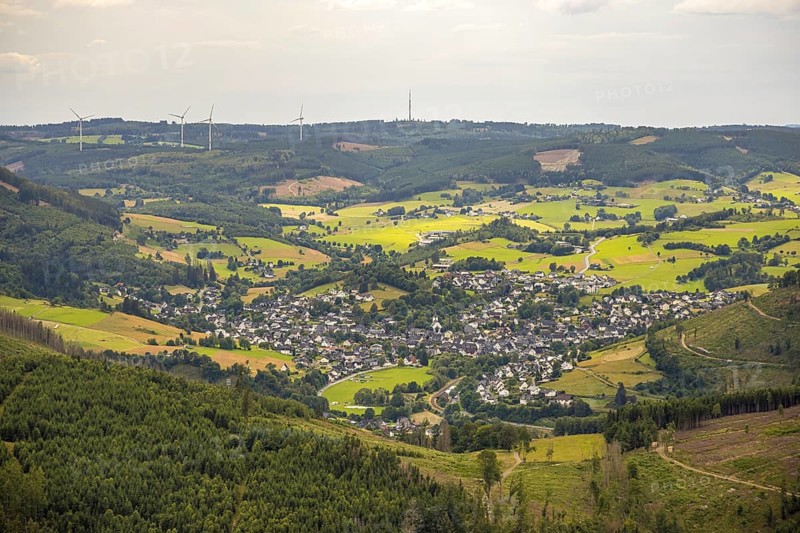 Aerial view, view of Feudingen in the valley, evang. Church and half-timbered houses, view of village and residential area, meadows and fields in hilly landscape, wooded area with forest damage, distant view, Feudingen, Bad Laasphe, Wittgensteiner Land, North Rhine-Westphalia, Germany, architecture, village, Europe, half-timbered houses, fields, buildings, hilly landscape, culture, landscape, agriculture, nature, natural disaster, local view, panorama, realism, religion, settlement, valley, environmental problems, forest area, forest damage, meadows, residential area, evangelic church, historical, rural, traditional, vegetation