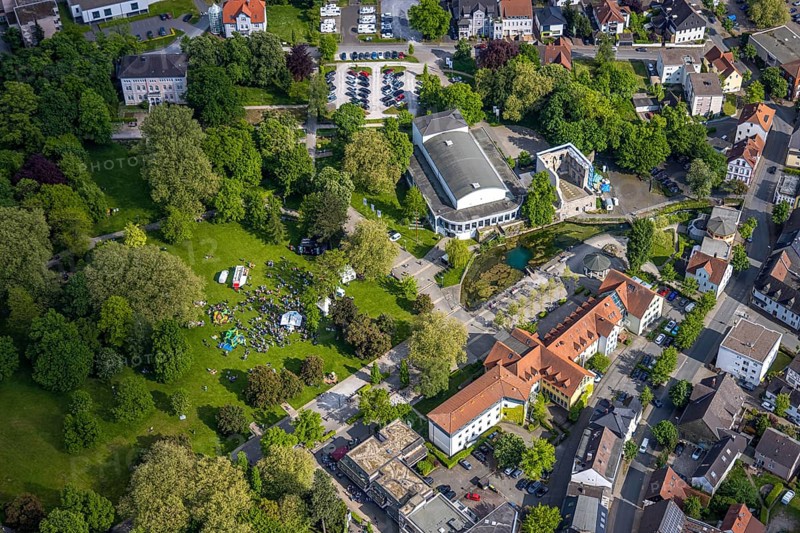 Aerial view, Congress Centre Bad Lippspringe, Arminius Park with castle ruins and river Lippequelle and Arminius Quelle Pavilion, Father's Day celebration in Arminius Park at the Congress Centre, visitors on the meadow, bouncy castle and drink stands, Bad Lippspringe, East Westphalia, North Rhine-Westphalia, Germany, Congress Centre, Arminius Park, castle ruins, river, Lippe Spring, Arminius Spring Pavilion, Father's Day festival, visitors, meadow, bouncy castle, drinks stands, celebration, leisure, family, recreation, people, children, adults, get-together, nature, park, history, architecture, daylight, landscape, culture, event, outdoors, summer, green, water, trees, fun, community