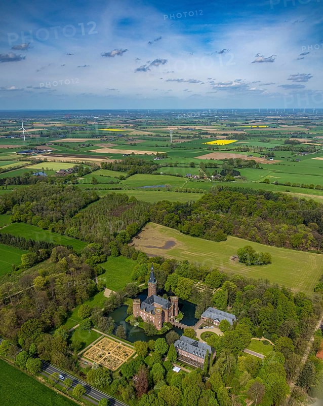 Aerial view, Museum Schloss Moyland, neo-Gothic moated castle and castle park surrounded by meadows and fields and forest, excursion destination on the Lower Rhine, Moyland, Bedburg-Hau, Lower Rhine, North Rhine-Westphalia, Germany, architecture, excursion destination, outdoor shot, building, visitor, trees, recreation, fields, leisure, history, green space, sky, culture, cultural heritage, landscape, museum, nature, panorama, park, tranquillity, Moyland Castle, castle park, sight, day, tourism, forest, water, meadows, historic, picturesque, neo-Gothic moated castle