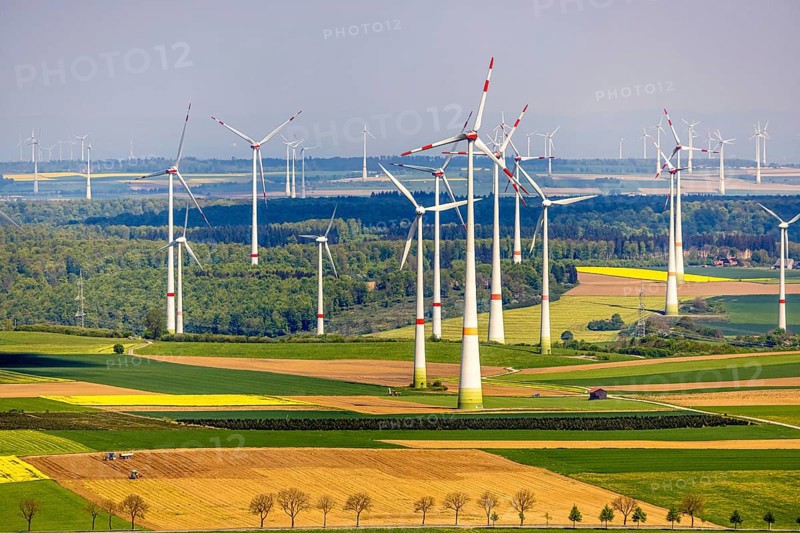 Aerial view, wind park and wind farm wind energy plant, wind turbines and rape fields near Radlinghausen, Messinghausen, Brilon, East Westphalia, Sauerland, North Rhine-Westphalia, Germany, wind park, wind farm, wind energy plant, wind turbines, rape fields, Radlinghausen, renewable energy, agriculture, landscape, energy production, environment, nature, fields, green, yellow, energy, electricity, rural, village, village life, sustainable energy, rural area, technology, infrastructure, aerial view, bird's eye view, wind power, climate, sustainability, windmills