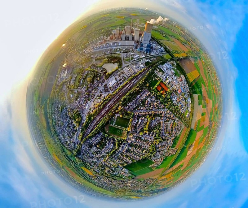 Aerial view, lignite-fired power plant Niederaußem, power plant site of RWE Power AG, cooling towers and clouds of smoke, view of residential area with goods station and Erftstolzstadion football stadium, earth globe, fisheye image, fisheye image, 360 degree image, tiny world, little planet, fisheye image, Niederaußem, Bergheim, Lower Rhine, North Rhine-Westphalia, Germany, lignite-fired power station, RWE Power AG, cooling towers, smoke clouds, residential area, goods station, Erftstolzstadion, football stadium, fisheye, fisheye shot, 360-degree shot, Tiny World, Little Planet, energy, power generation, environment, industry, city, infrastructure, transport, sport, technology, perspective, air pollution, architecture, urban, landscape