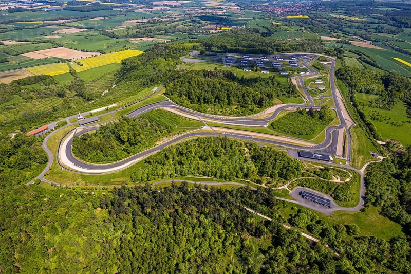 Aerial view, Bilster Berg race track, test track and presentation track, park-like terrain with paddock and off-road course, Pömbsen, Bad Driburg, East Westphalia, North Rhine-Westphalia, Germany, Bilster Berg, race track, test track, presentation track, park-like, paddock, off-road course, terrain, nature, trees, roads, curves, landscape, outdoor, sport, motorsport, vehicles, technology, recreation, green areas, leisure, facility, architecture, infrastructure, aerial view, perspective, day, tranquillity