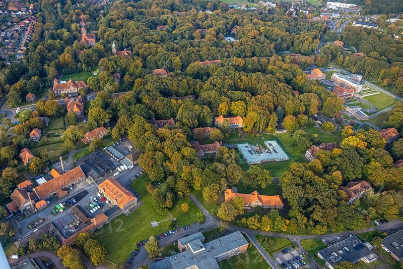 Aerial view, view LVR clinic in autumnal forest, new building, Hau, Bedburg-Hau, autumnal forest, Lower Rhine, North Rhine-Westphalia, Germany, view, architecture, exterior, trees, development, colourfulness, building, health facility, health care, autumn, infrastructure, season, clinic, LVR clinic, landscape, foliage, nature, panorama, structure, environment, bird's eye view, forest, peaceful, rural, calm atmosphere, vegetation