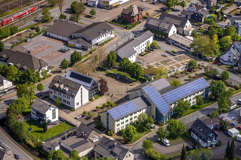 Aerial view, municipal administration town hall Bestwig with solar roof, town hall square, Lidl supermarket, Sparkasse Hochsauerland, Bestwig, Sauerland, North Rhine-Westphalia, Germany, municipal administration, town hall, solar roof, Lidl, supermarket, Sparkasse, Hochsauerland, building, town, infrastructure, photovoltaics, retail, banks, public building, architecture, town centre, energy efficiency, sustainability, technology, renewable energies, street, traffic, economy, village, surroundings, exterior view, modern, administration, business, shopping centre, solar energy