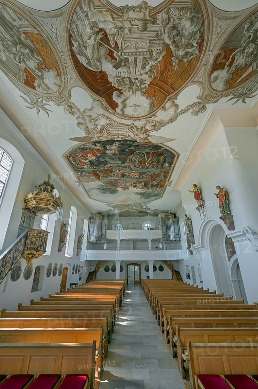 Interior of the Roman Catholic parish church of the Assumption of the Virgin Mary with organ loft and ceiling frescoes in Gebrazhofen, district of the large district town of Leutkirch im Allgäu, district of Ravensburg, Baden-Württemberg, Germany