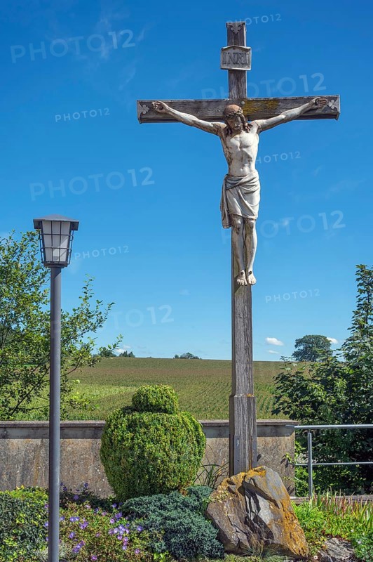 Crucifix and lantern at the Roman Catholic parish church of the Assumption of the Virgin Mary in Gebrazhofen, district of the large district town of Leutkirch im Allgäu, district of Ravensburg, Baden-Württemberg, Germany