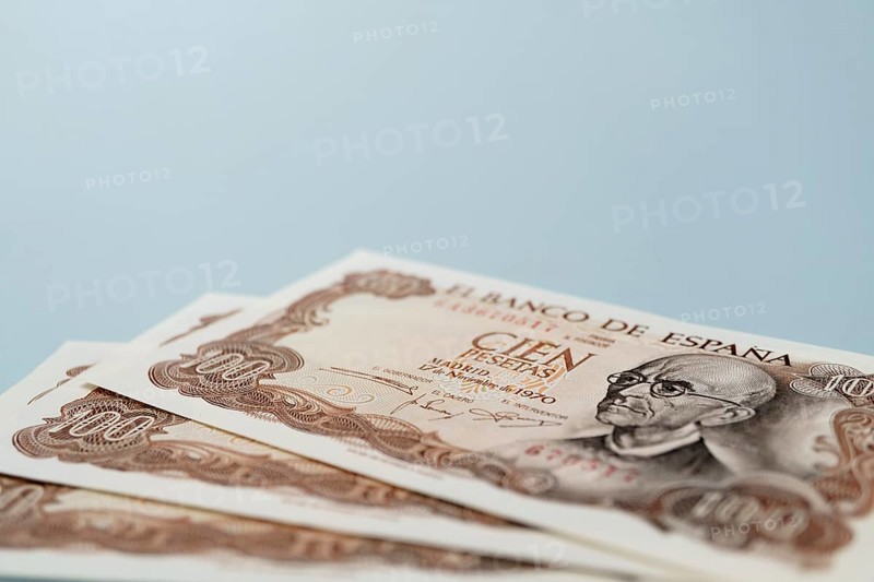 Stack of old one hundred pesetas banknotes issued by bank of spain in 1970 featuring the portrait